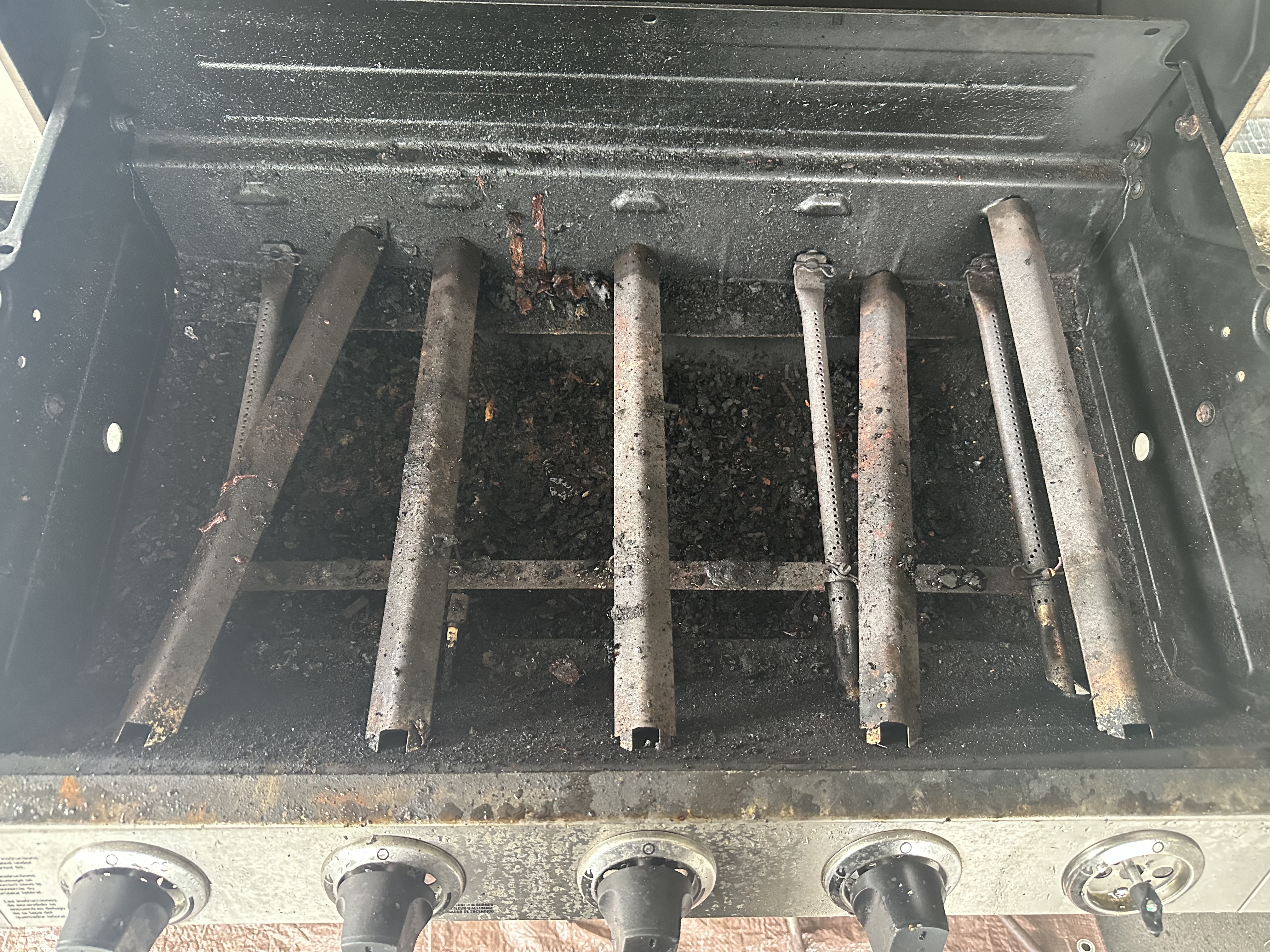 Dirty grill grates before cleaning